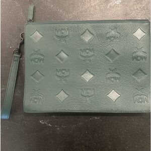 Mcm maxi logo leather pouch